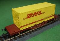 DB Flachwagen mit (Flat car with) 20' Container DHL ax904492